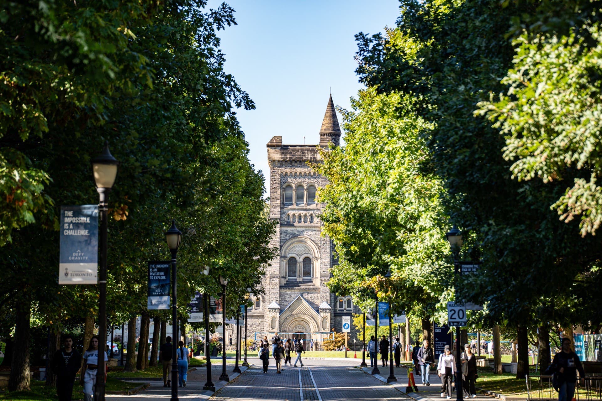A university campus building framed by trees